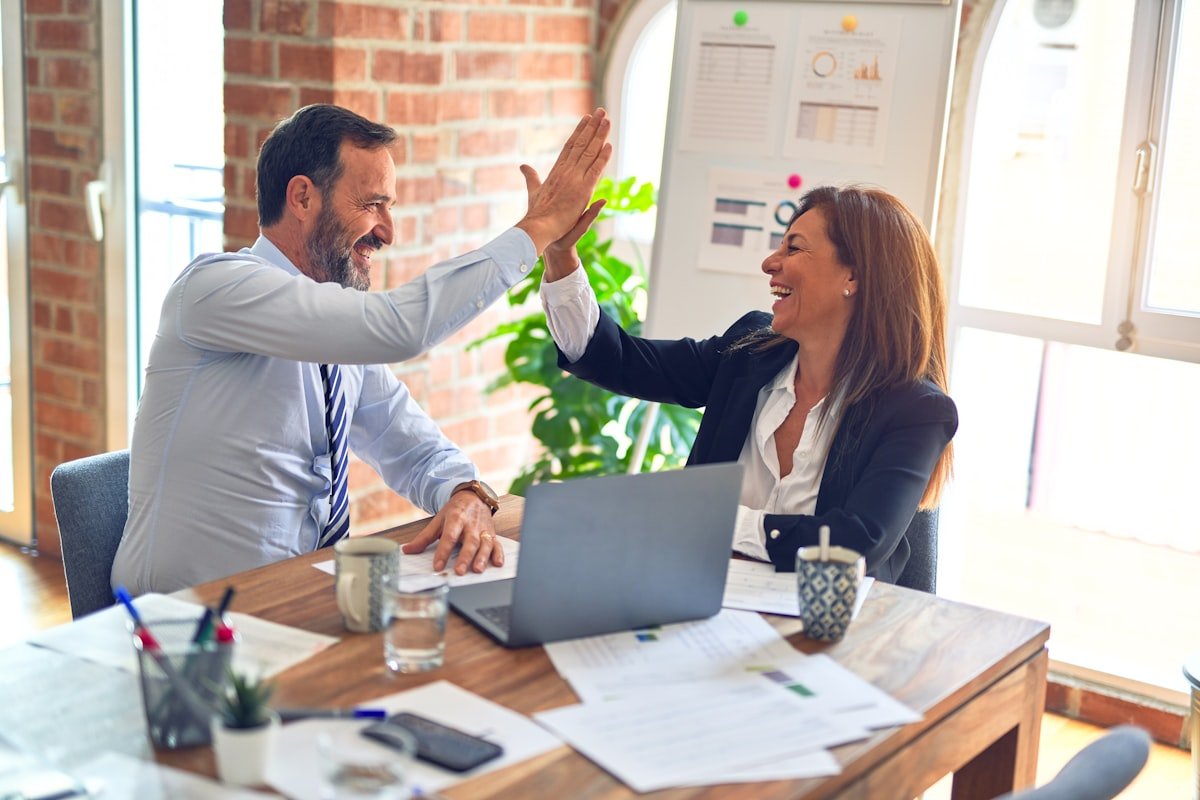 Construction manager shaking hands with a client